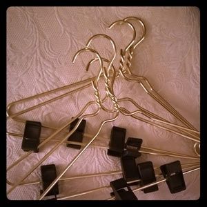 Set of 5 nice goldtone aluminum suit hangers